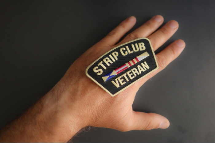 Strip Club Veteran Patch shown on hand for size comparison