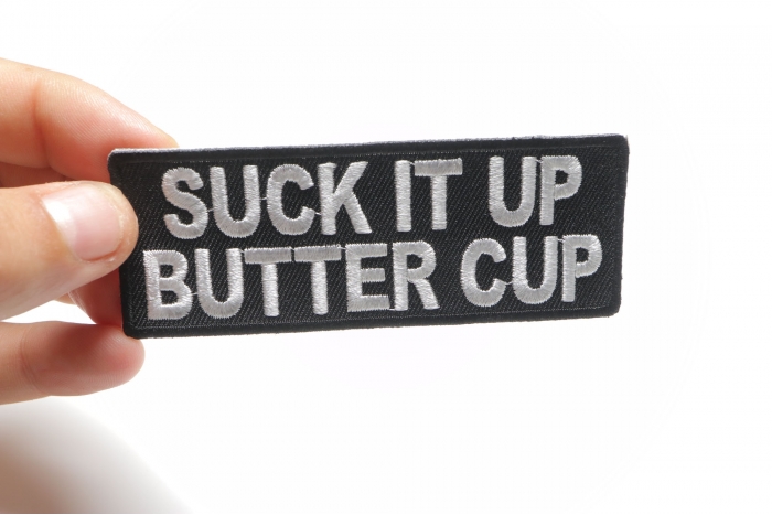 Suck It Up Butter Cup Patch, Biker Sayings shown on hand for size comparison