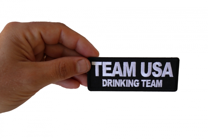 Team USA Drinking Team Funny Iron on Patch shown on hand for size comparison