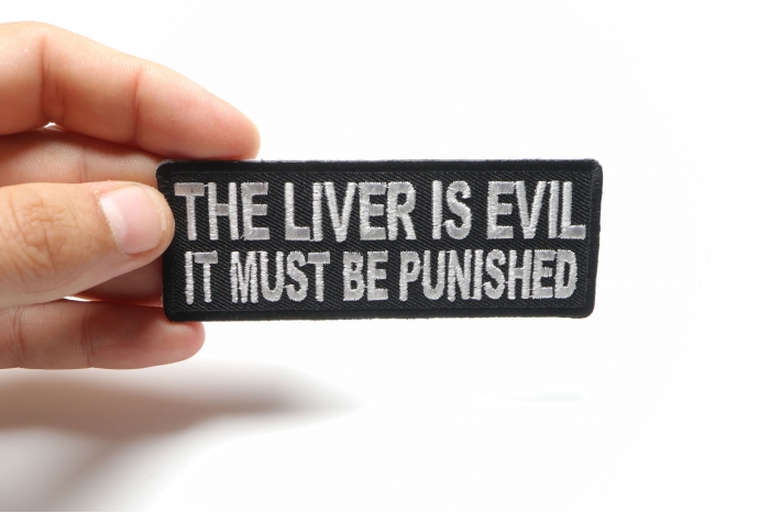 The Liver Is Evil It Must Be Punished Funny Iron on Patch shown on hand for size comparison