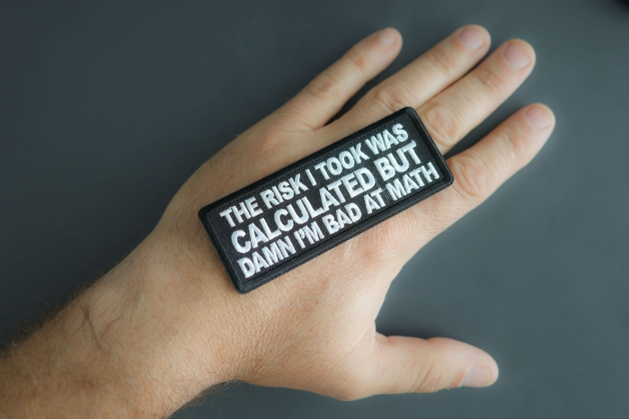 The Risk I Took Was Calculated But Damn I'm Bad At Math Patch shown on hand for size comparison