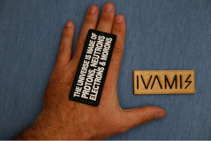 The Universe is made of protons neutrons electrons and morons patch, Funny Saying Patches, Sew or Iron on shown on hand for size comparison
