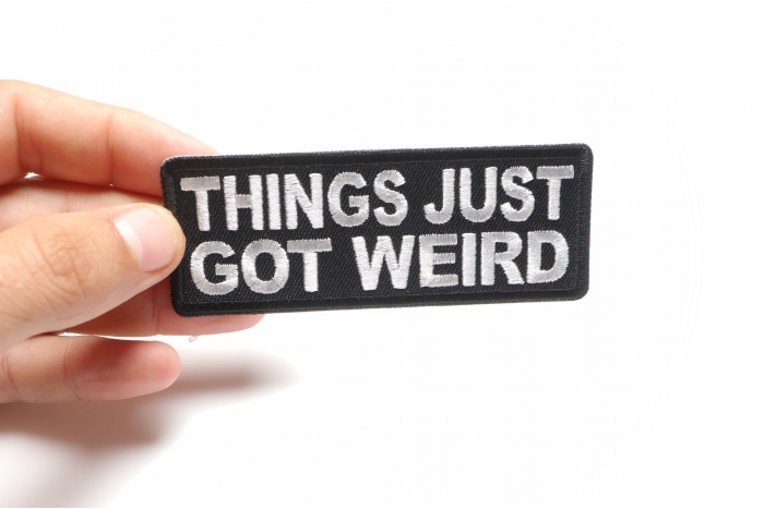 Things Just Got Weird Funny Iron on Patch shown on hand for size comparison