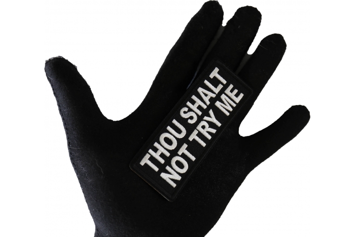 Thou Shalt Not Try Me Funny Iron on Patch shown on hand for size comparison