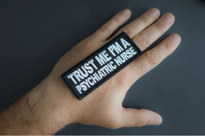 Trust Me I'm A Psychiatric Nurse Patch shown on hand for size comparison