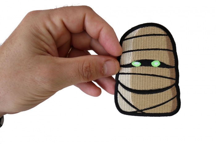 Wacky Mummy Iron on Funny Iron on Patch shown on hand for size comparison