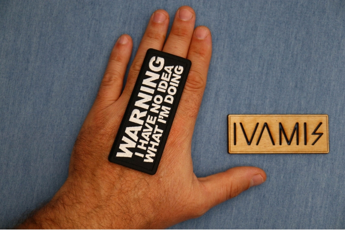 Warning I have no Idea what I'm Doing Patch shown on hand for size comparison