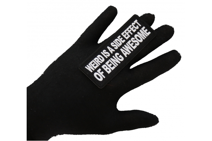 Weird is a side effect of Being Awesome Patch, Funny Saying Patches shown on hand for size comparison