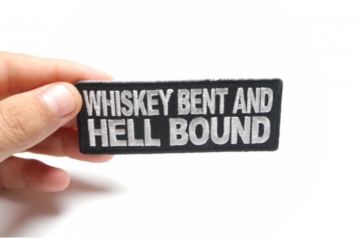 Whiskey Bent and Hell Bound Funny Iron on Patch shown on hand for size comparison
