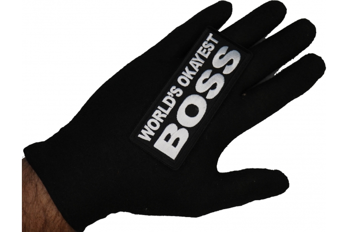 World's Okayest Boss Patch shown on hand for size comparison