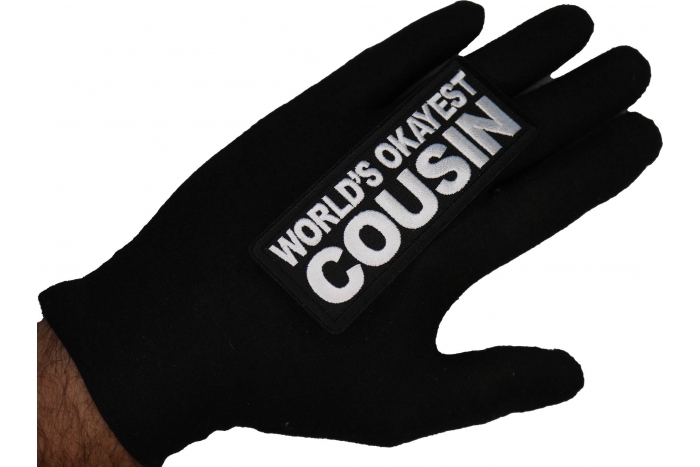 World's Okayest Cousin Patch shown on hand for size comparison