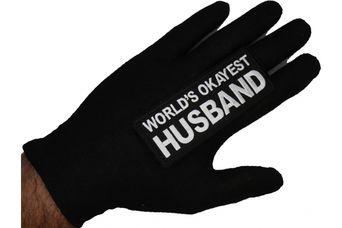 World's Okayest Husband Patch shown on hand for size comparison