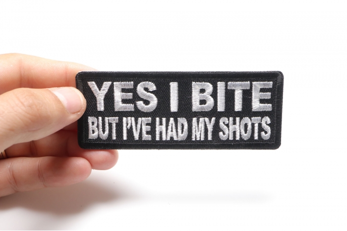 Yes I Bite But I've Had My Shots Funny Iron on Patch shown on hand for size comparison