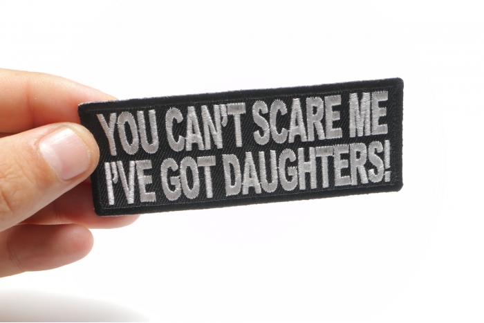 You Can't Scare Me I've Got Daughters Funny Patch shown on hand for size comparison