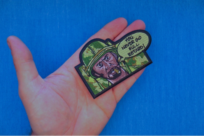 You Never go Full Retard Patch shown on hand for size comparison