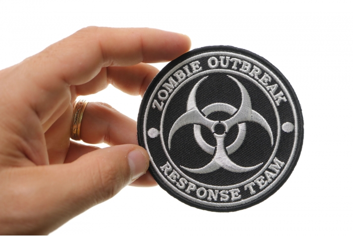 Zombie Outbreak Response Team Funny Iron on Patch shown on hand for size comparison