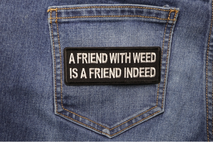 A Friend with Weed is a Friend indeed Funny Iron on Patch shown on jeans