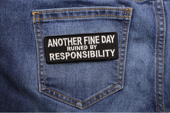Another Fine Day Ruined By Responsibility Funny Iron on Patch shown on jeans
