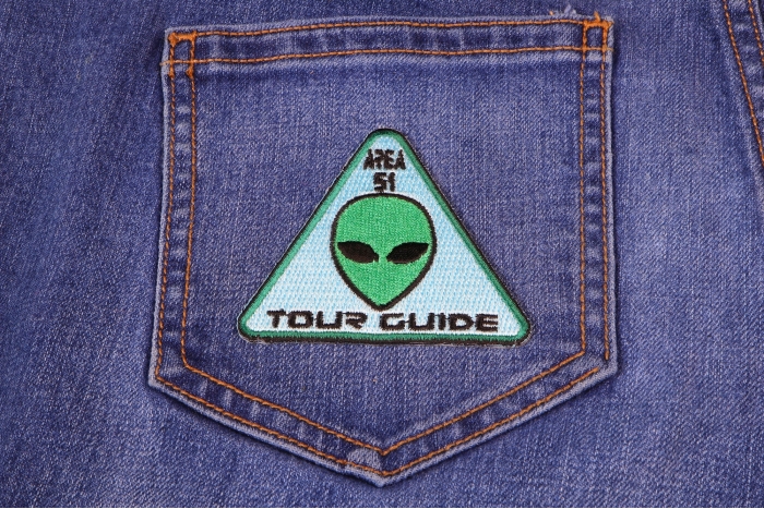 Area 51 Tour Guide Funny Iron on Patch Alien Head shown on jeans