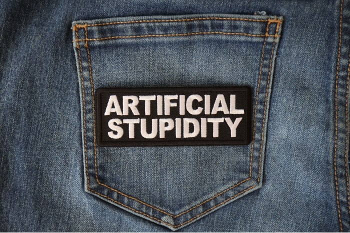 Artificial Stupidity Funny Iron on Patch shown on jeans