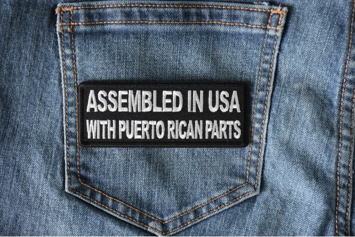 Assembled in USA with Puerto Rican Parts Funny Iron on Patch shown on jeans