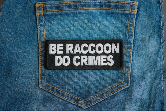 Be Raccoon Do Crimes Patch shown on jeans