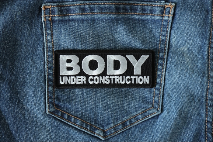 Body under construction Patch shown on jeans