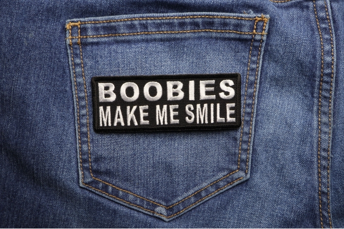 Boobies Make Me Smile Funny Iron on Patch shown on jeans