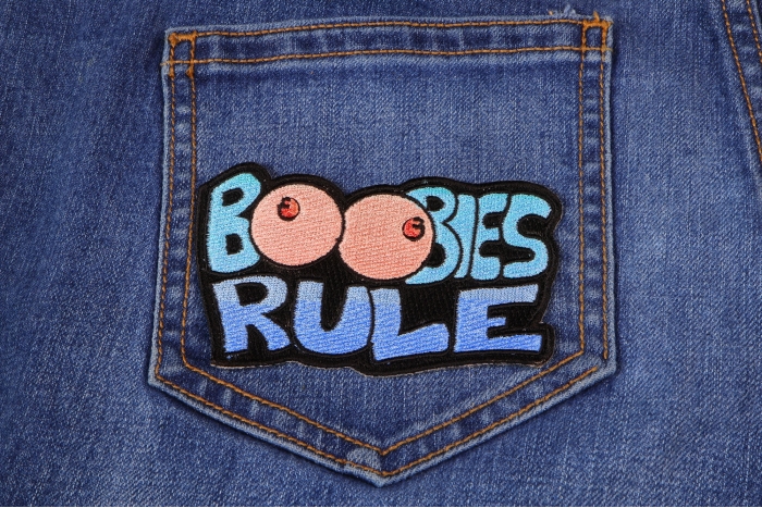Boobies Rule Funny Iron on Patch shown on jeans
