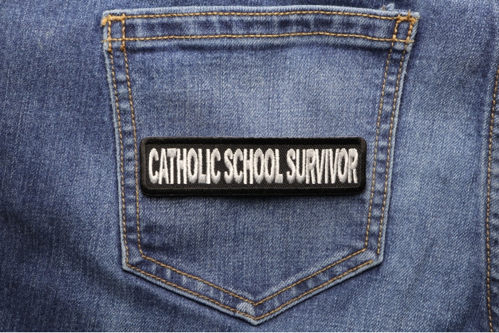 Catholic School Survivor Funny Christian Patch shown on jeans