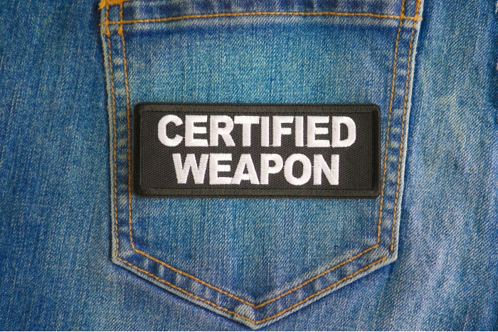 Certified Weapon Patch shown on jeans