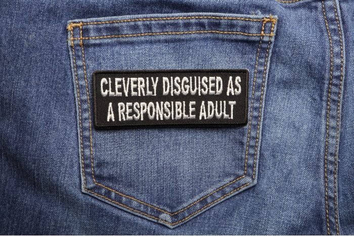 Cleverly Disguised As A Responsible Adult Patch shown on jeans