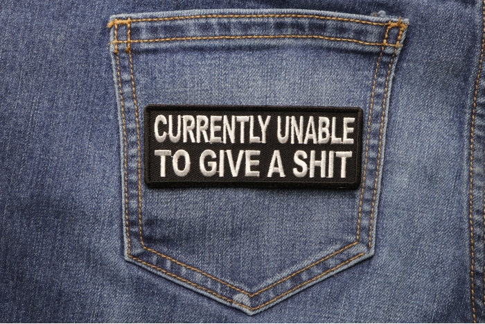 Currently Unable To Give A Shit Funny Iron on Patch shown on jeans