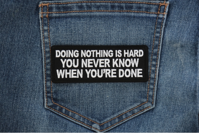 Doing Nothing is Hard, You never know when you're done Funny Iron on Patch shown on jeans