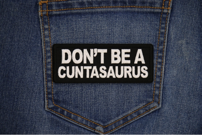 Don't Be a Cuntasaurus Patch shown on jeans