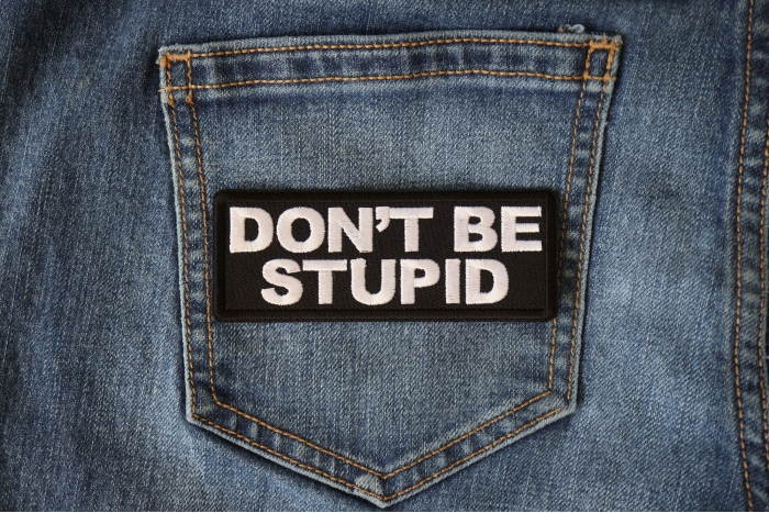 Don't Be Stupid Patch shown on jeans