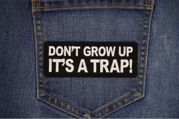 Don't Grow Up It's a Trap Patch shown on jeans