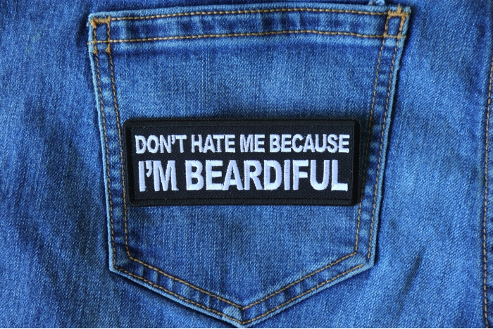 Don't Hate me Because I'm Beardiful Funny Iron on Patch shown on jeans