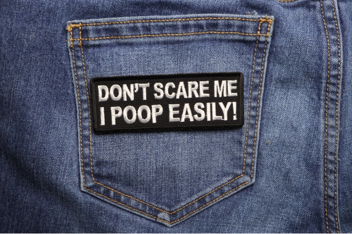 Don't Scare me I Poop Easily Funny Iron on Patch shown on jeans