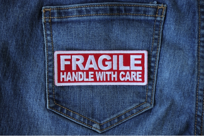 Fragile Handle with Care Funny Iron on Patch shown on jeans