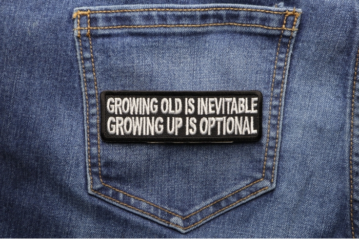 Growing Old Is Inevitable Growing Up Is Optional Funny Iron on Patch shown on jeans