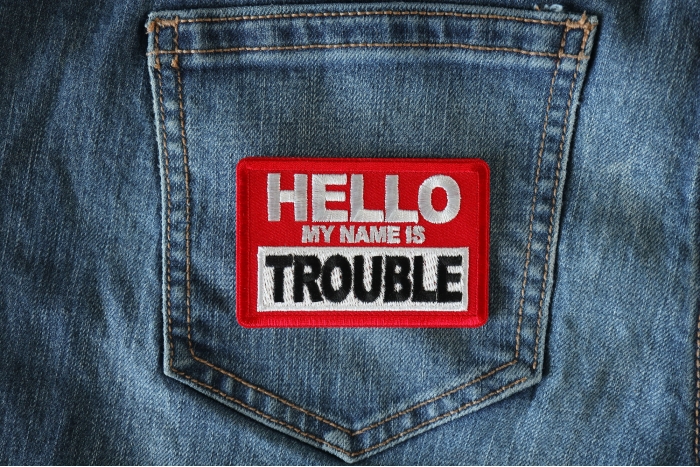 Hello My Name is Trouble Funny Iron on Patch shown on jeans