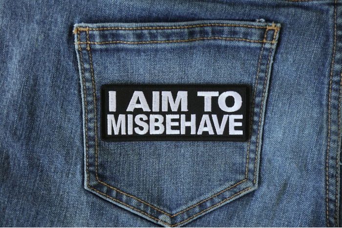 I aim to Misbehave Funny Iron on Patch shown on jeans
