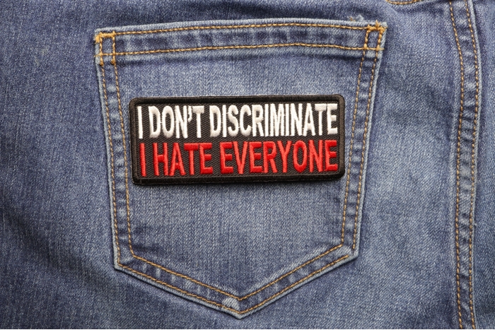 I Don't Discriminate I Hate Everyone Funny Iron on Patch shown on jeans
