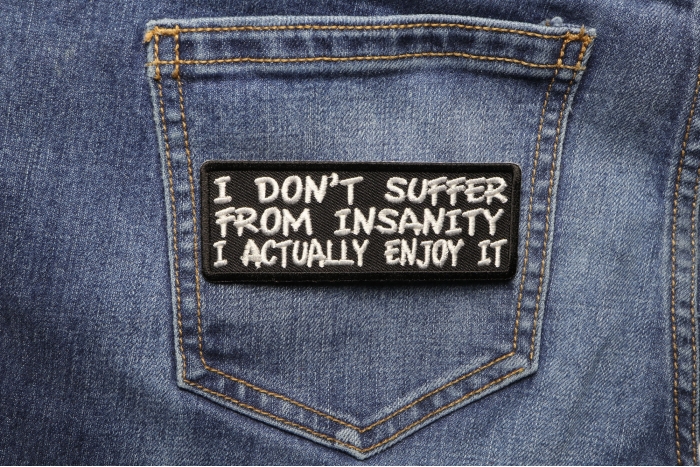 I Don't Suffer From Insanity I Actually Enjoy It Funny Iron on Patch shown on jeans