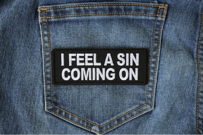 I Feel a Sin Coming On Funny Iron on Patch shown on jeans