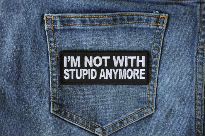 I'm Not With Stupid Anymore Funny Iron on Patch shown on jeans