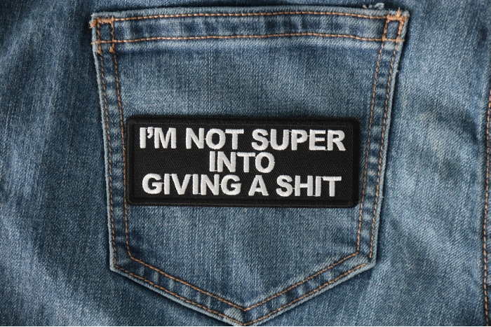 I'm not Super into Giving a shit Funny Iron on Patch shown on jeans