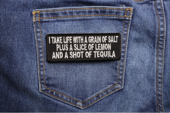 I Take Life With A Grain Of Salt Slice Of Lemon and Shot Of Tequila Funny Iron on Patch shown on jeans