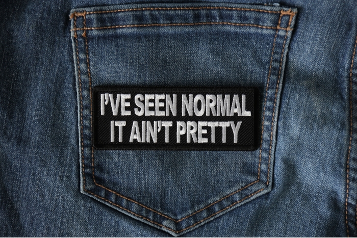 I've Seen Normal It Ain't Pretty Funny Iron on Patch shown on jeans